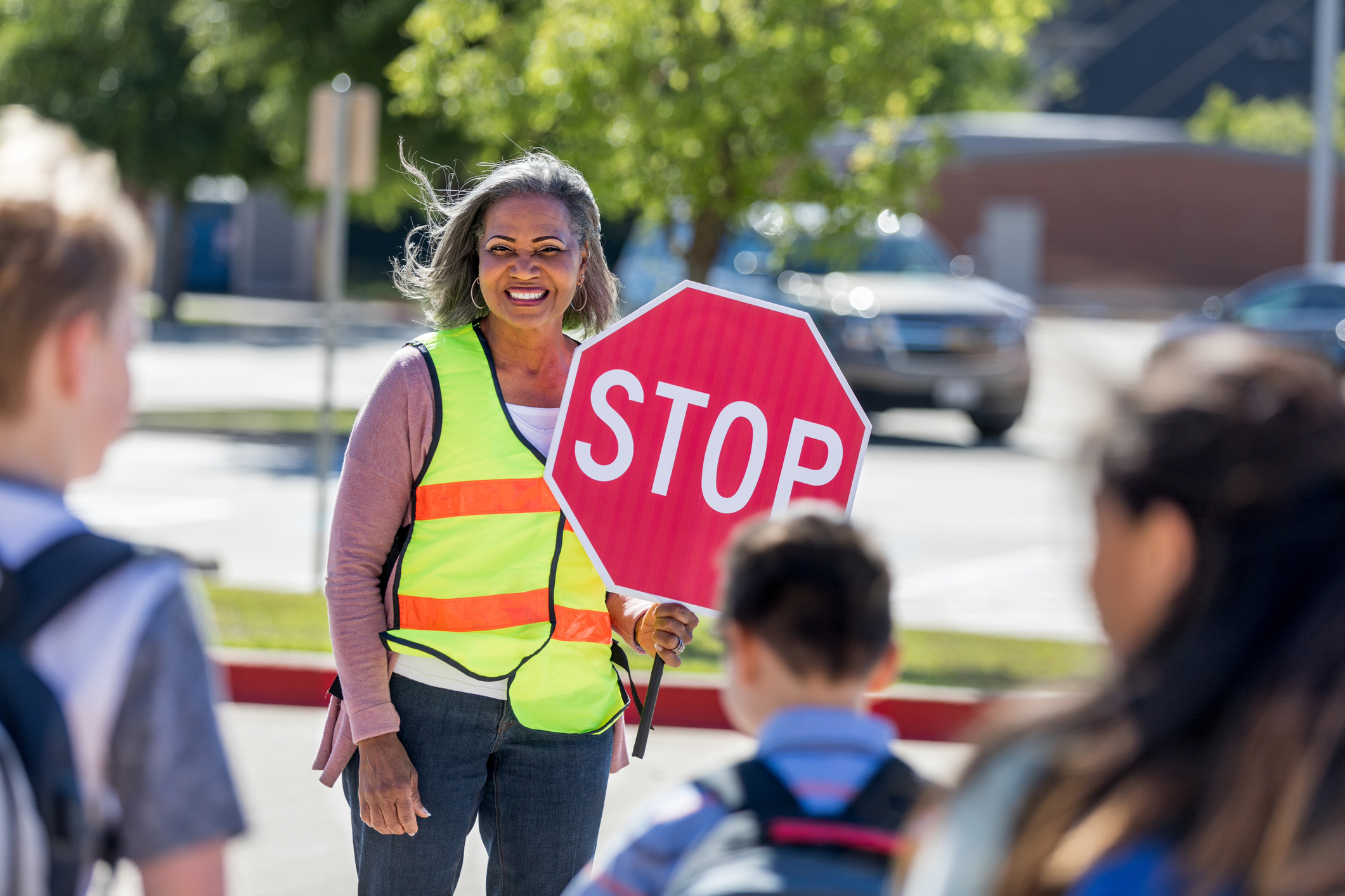 Crossing guard tells children to stop